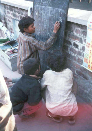 Children having a class in the street
